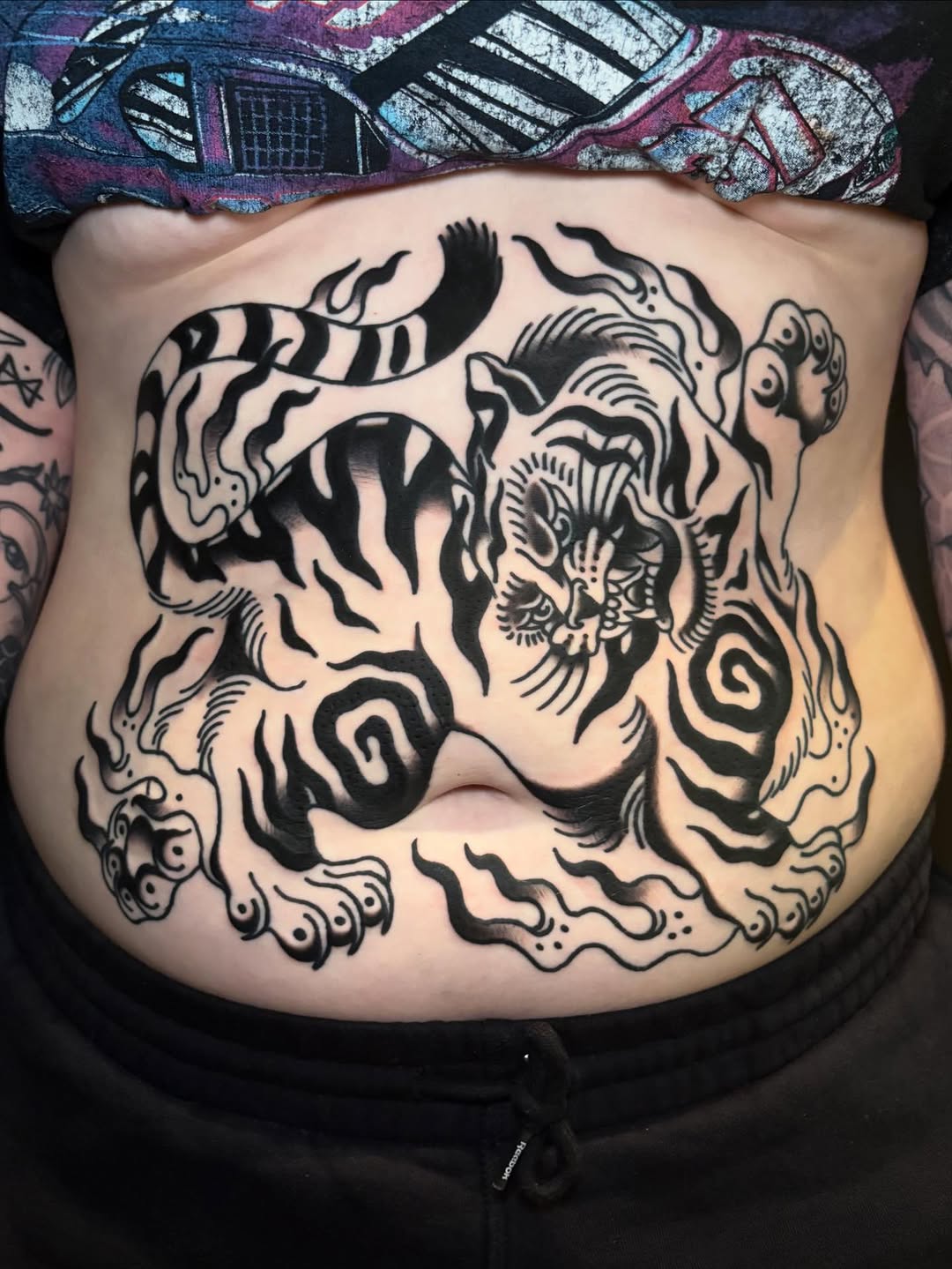 Traditional tiger belly tattoo by Rikki Kander