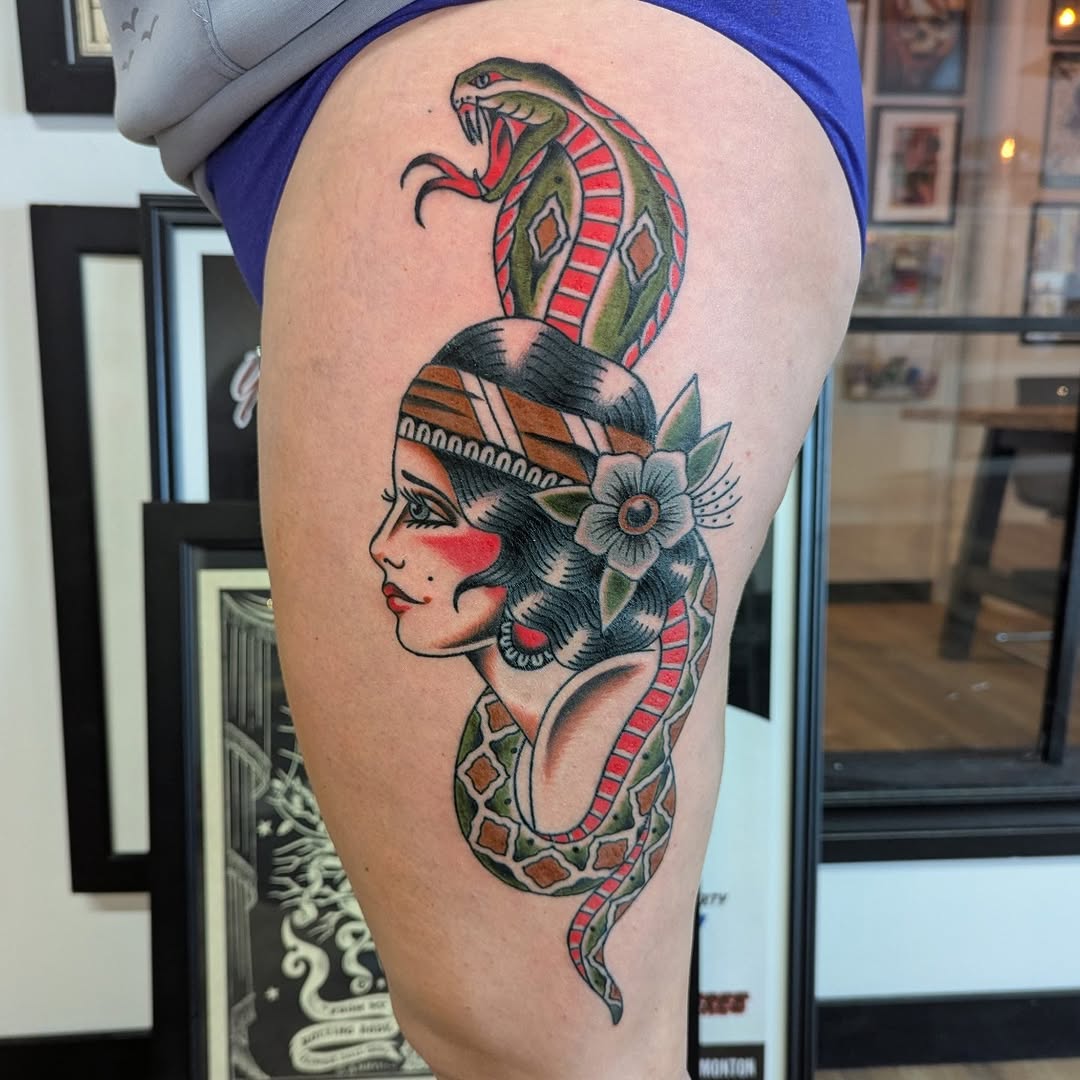 Lady head with cobra traditional tattoo by Rikki Kander