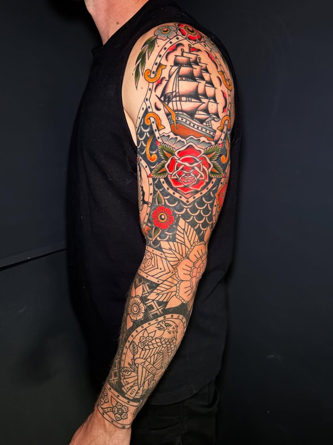 Full sleeve traditional tattoo by Rikki Kander