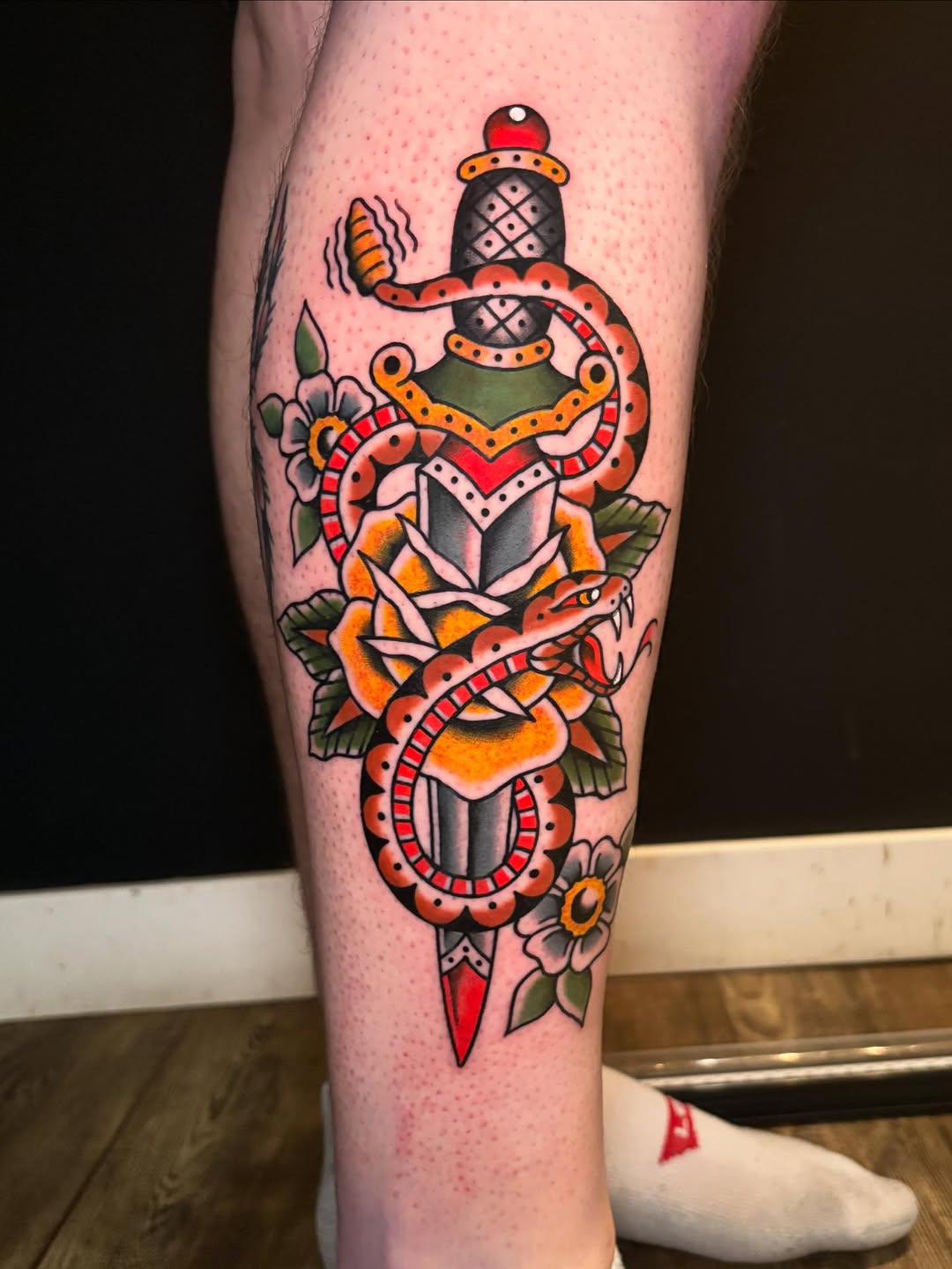 Snake and dagger traditional tattoo by Rikki Kander