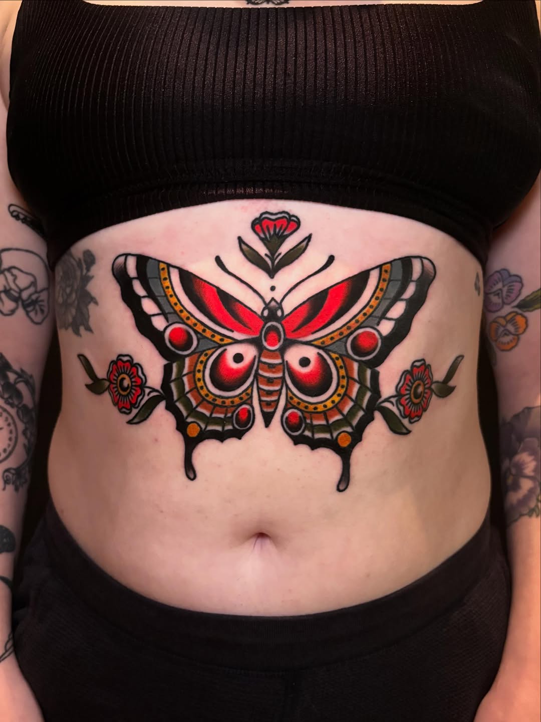 Butterfly belly traditional tattoo by Rikki Kander